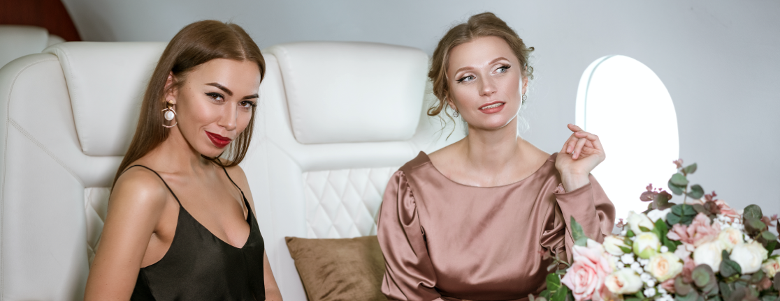 sharing_2@2x Beautiful young ladies flying in a private jet