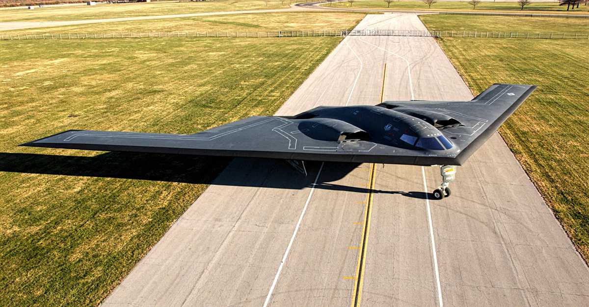 The striking B-2 Spirit stealth bomber, parked on the ground, represents the most expensive jet in the world, exemplifying cutting-edge technology and unparalleled military prowess