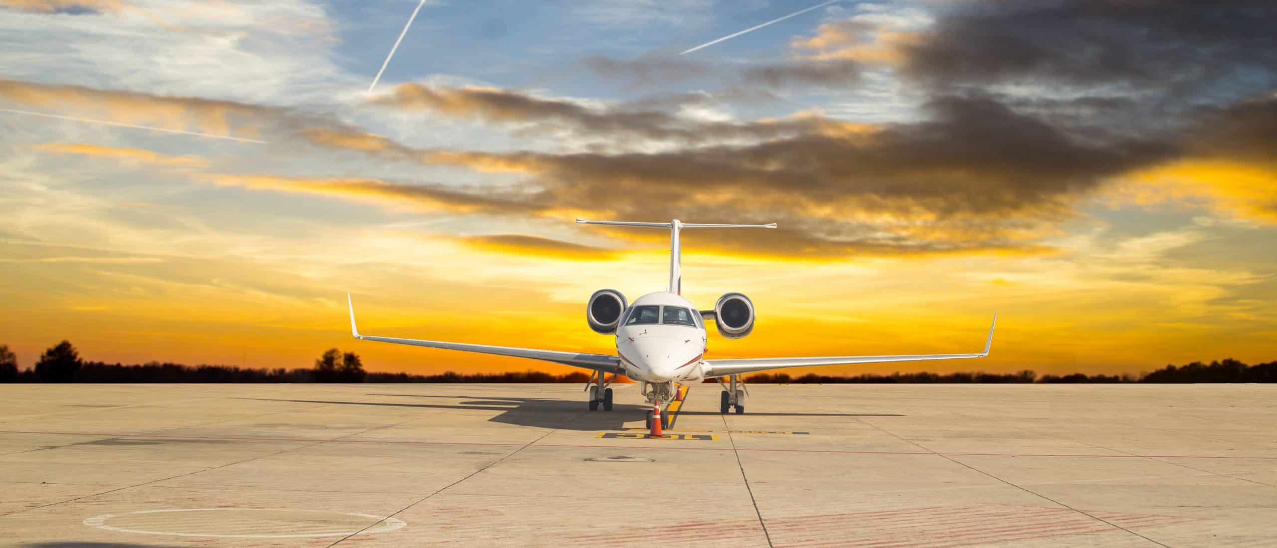A magnificent private jet basks in the warm glow of a breathtaking sunset, symbolizing the pinnacle of luxury travel and the ultimate flying experience