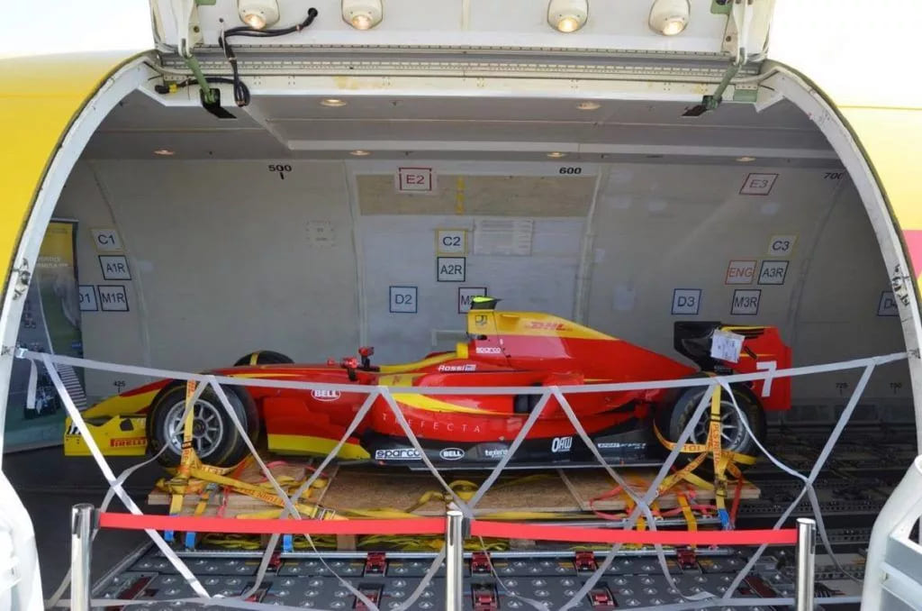 Formula 1 car inside cargo plane