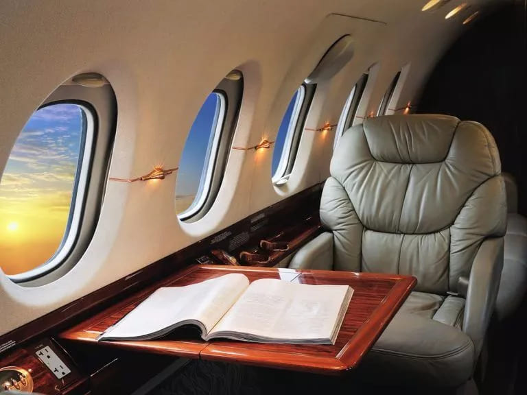 Luxurious and comfortable seating in a private jet, offering passengers an exceptional travel experience with the perfect blend of style and relaxation