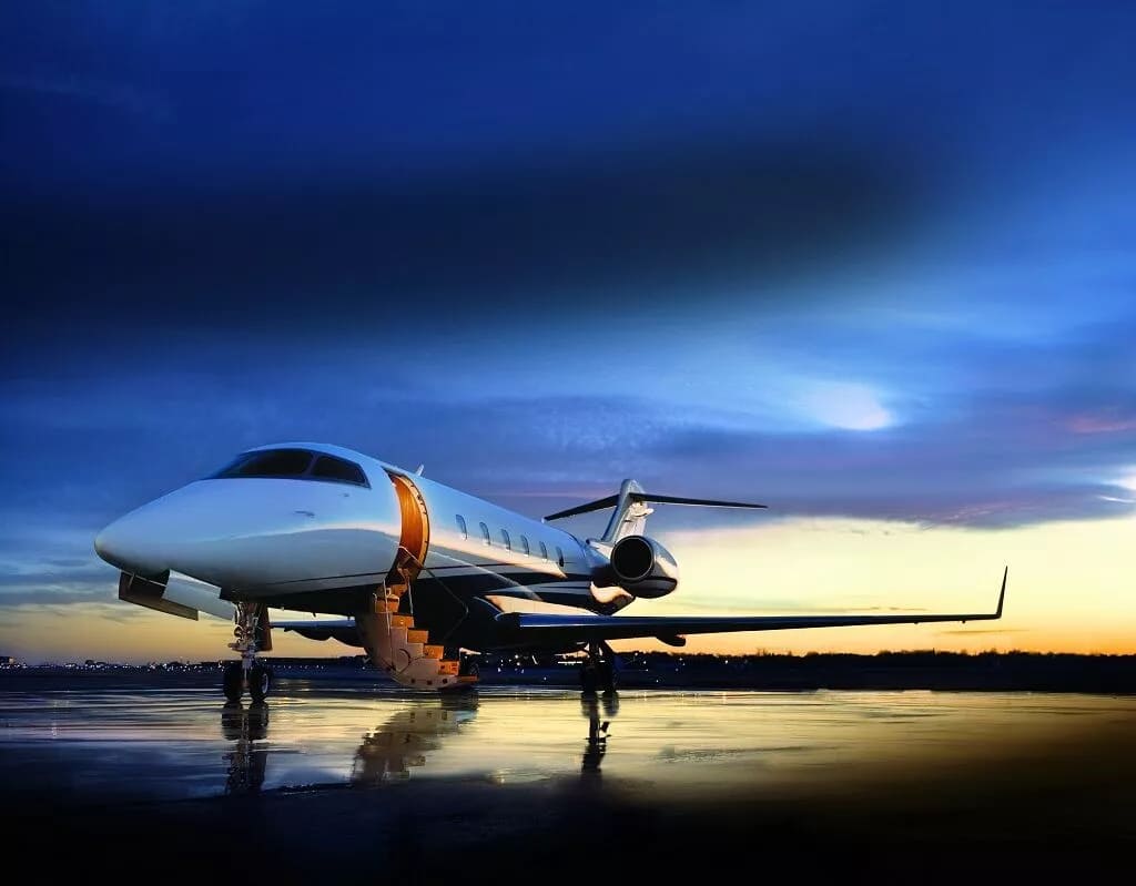 Private Jet Sitting on a Runway at Sunset