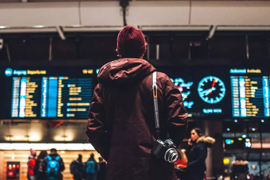 Best airports in the world. A passenger looking at the departure screen