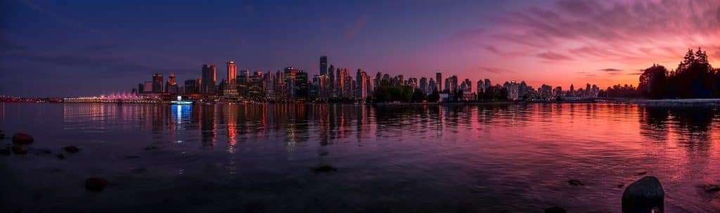 Panoramic view of Vancouver at sunset. Fly private to Vancouver