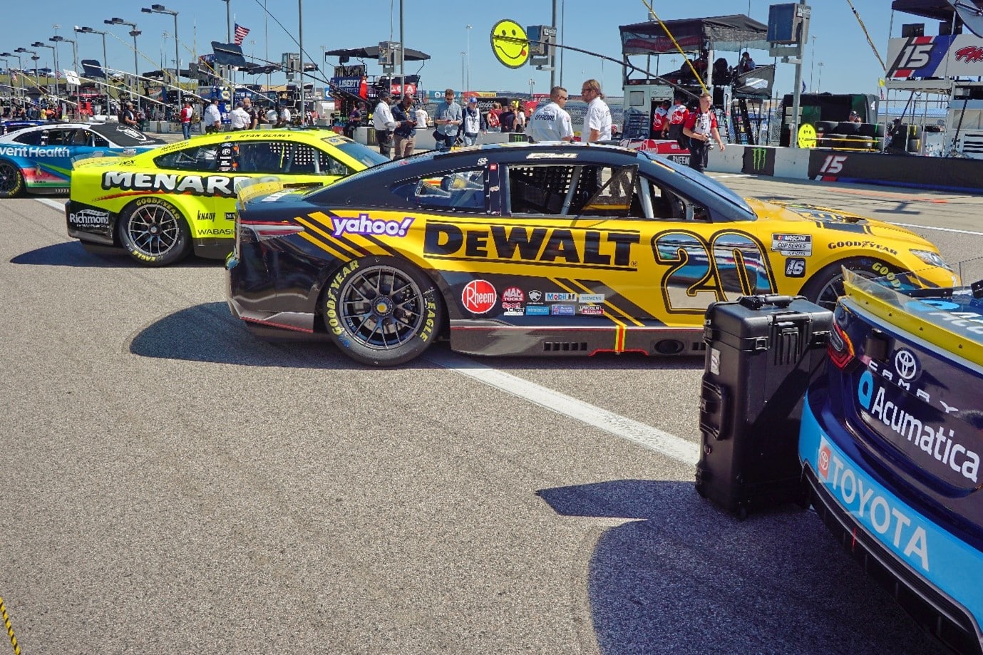 Nascar Cars Lining Up by Pit Side