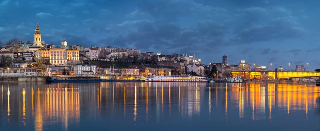 Old Belgrade panorama by night with Cathedral and Branko's bridge. Fly Private Jet.