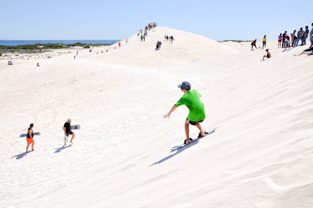 Sandboarding at Lancelin sand dunes. Fly Private to Perth.