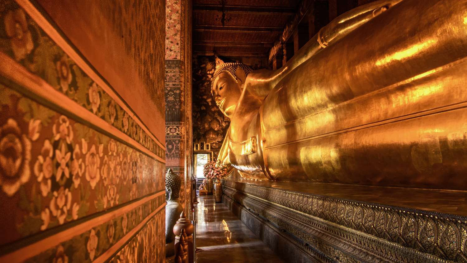 Big Reclining golden Buddha statue. Fly private to Bangkok.